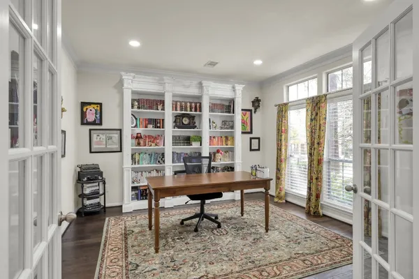 a view of a livingroom with furniture and windows