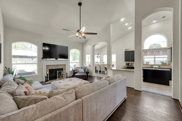 a living room with furniture fireplace and a flat screen tv