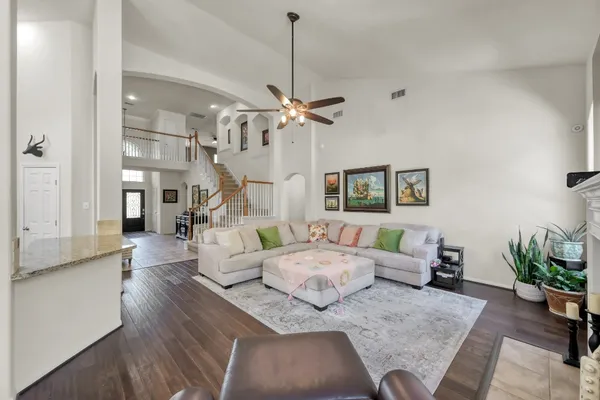 a living room with furniture chandelier and a chandelier