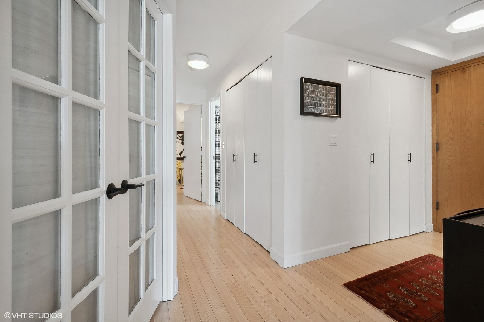 40 East Delaware Place, Unit 1003 Chicago, IL 60611 - Photo 12 of 22 a view of a hallway with wooden floor and staircase