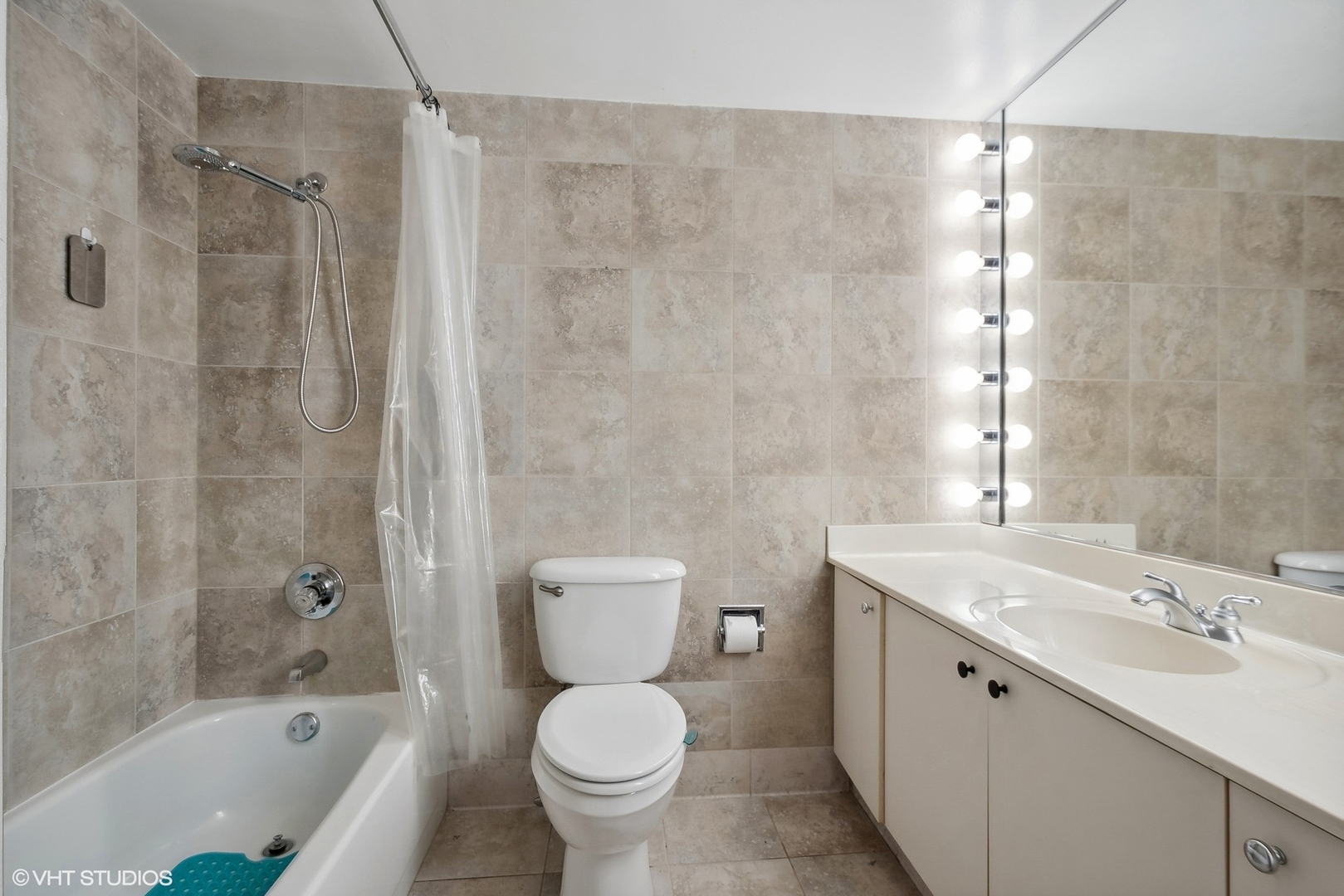 40 East Delaware Place, Unit 1003 Chicago, IL 60611 - Photo 14 of 22 a bathroom with a sink toilet a shower and bathtub