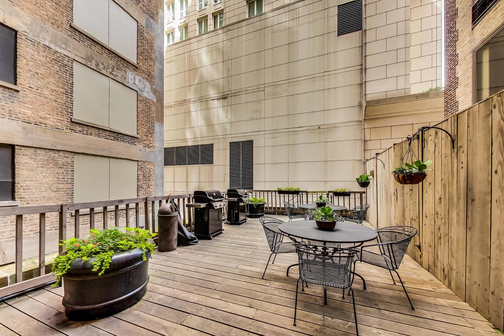 40 East Delaware Place, Unit 1003 Chicago, IL 60611 - Photo 21 of 22 a view of a patio with couple of chairs
