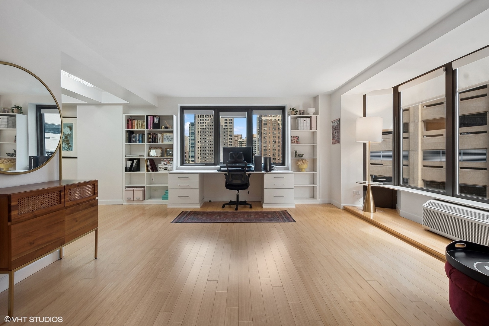 40 East Delaware Place, Unit 1003 Chicago, IL 60611 - Photo 5 of 22 a living room with furniture and large windows