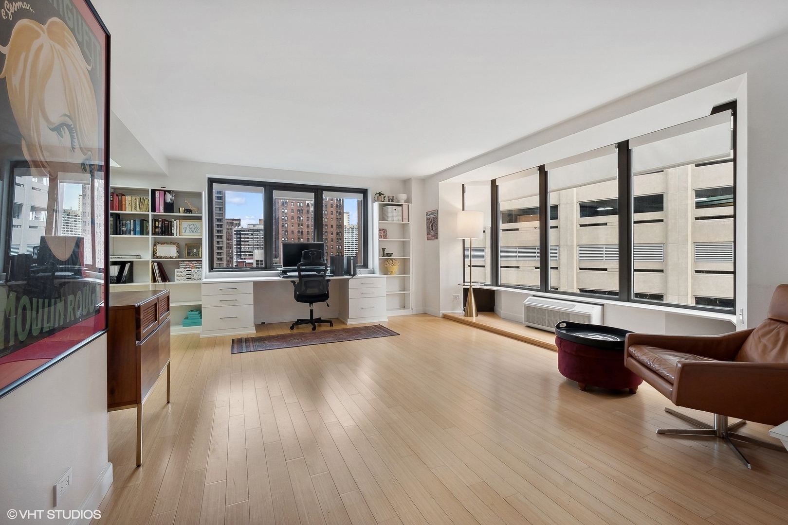 40 East Delaware Place, Unit 1003 Chicago, IL 60611 - Photo 6 of 22 a living room with furniture stove and wooden floor