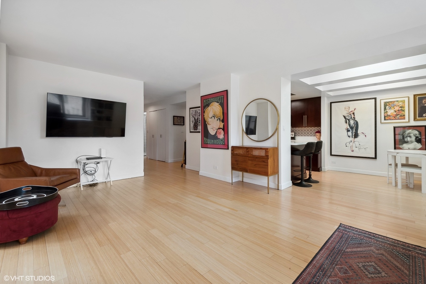 40 East Delaware Place, Unit 1003 Chicago, IL 60611 - Photo 7 of 22 a living room with furniture and a flat screen tv