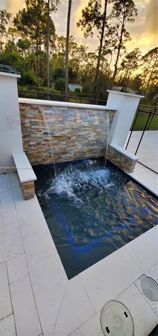 a view of a dining room with furniture and a window