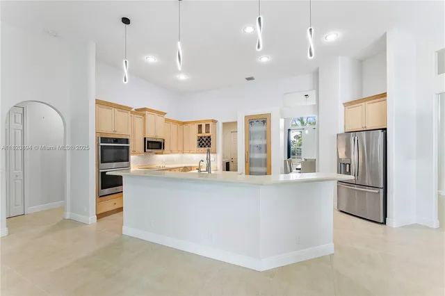 a view of room with wooden floor and windows