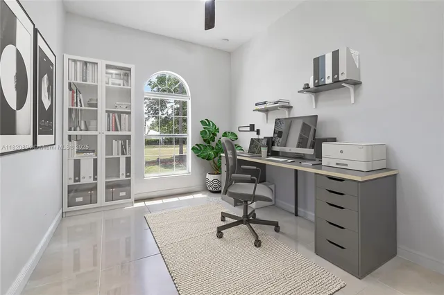 a bath tub sitting in a bathroom next to a window