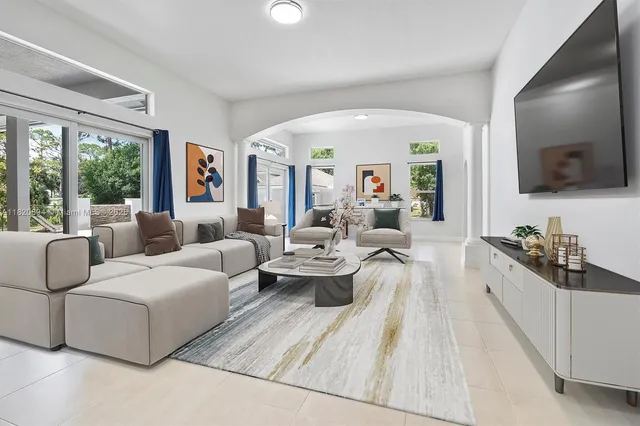 a en suite bathroom with a granite countertop sink and a mirror