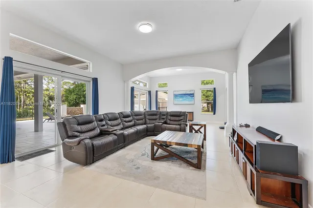 a bedroom with a bed and a mirror