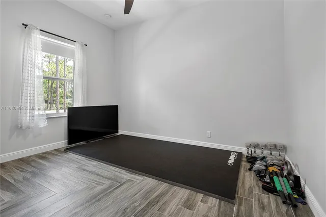 a living room with a couch and a chandelier