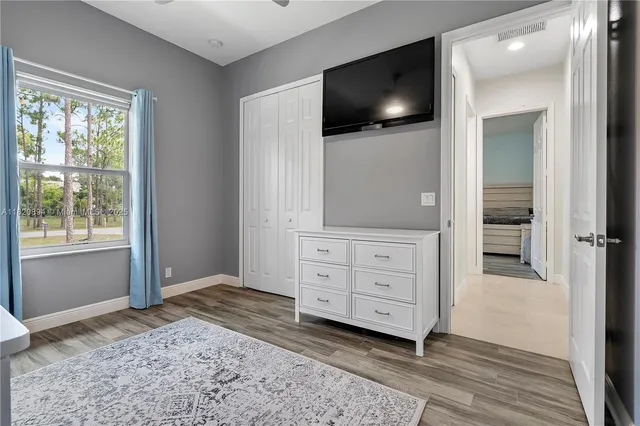 a view of a livingroom with furniture and a window