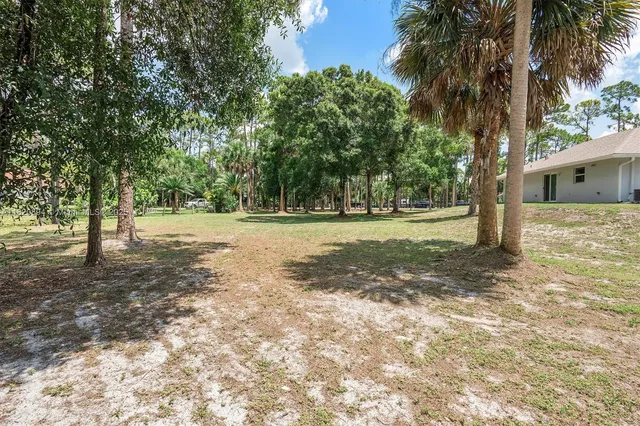 a view of a golf course with a fountain