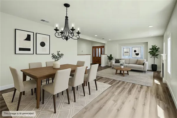 a view of empty room with wooden floor and fireplace