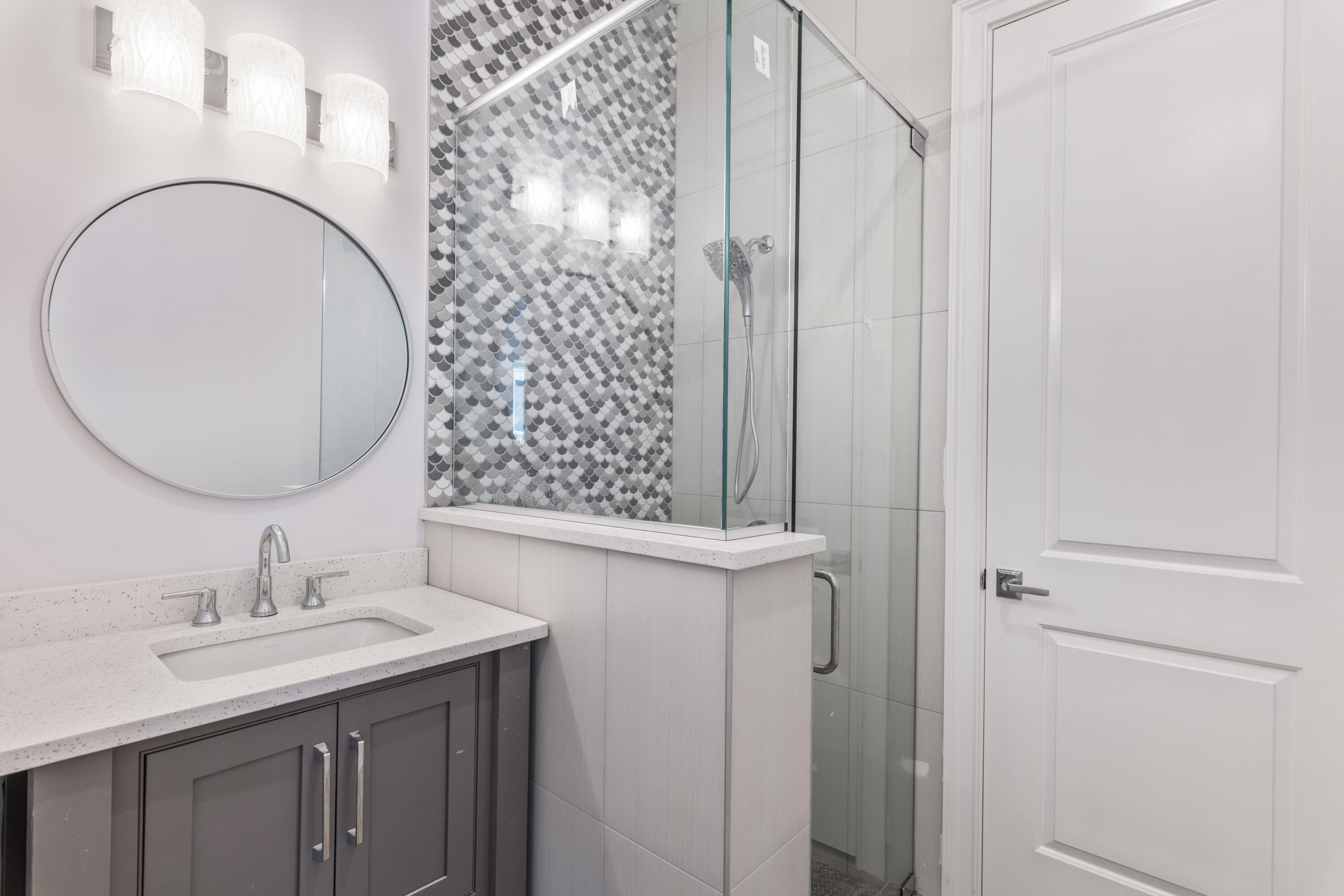26 Azzurro Way, Unit B Santa Rosa Beach, FL 32459 - Photo 13 of 34 a bathroom with a sink vanity granite and a mirror