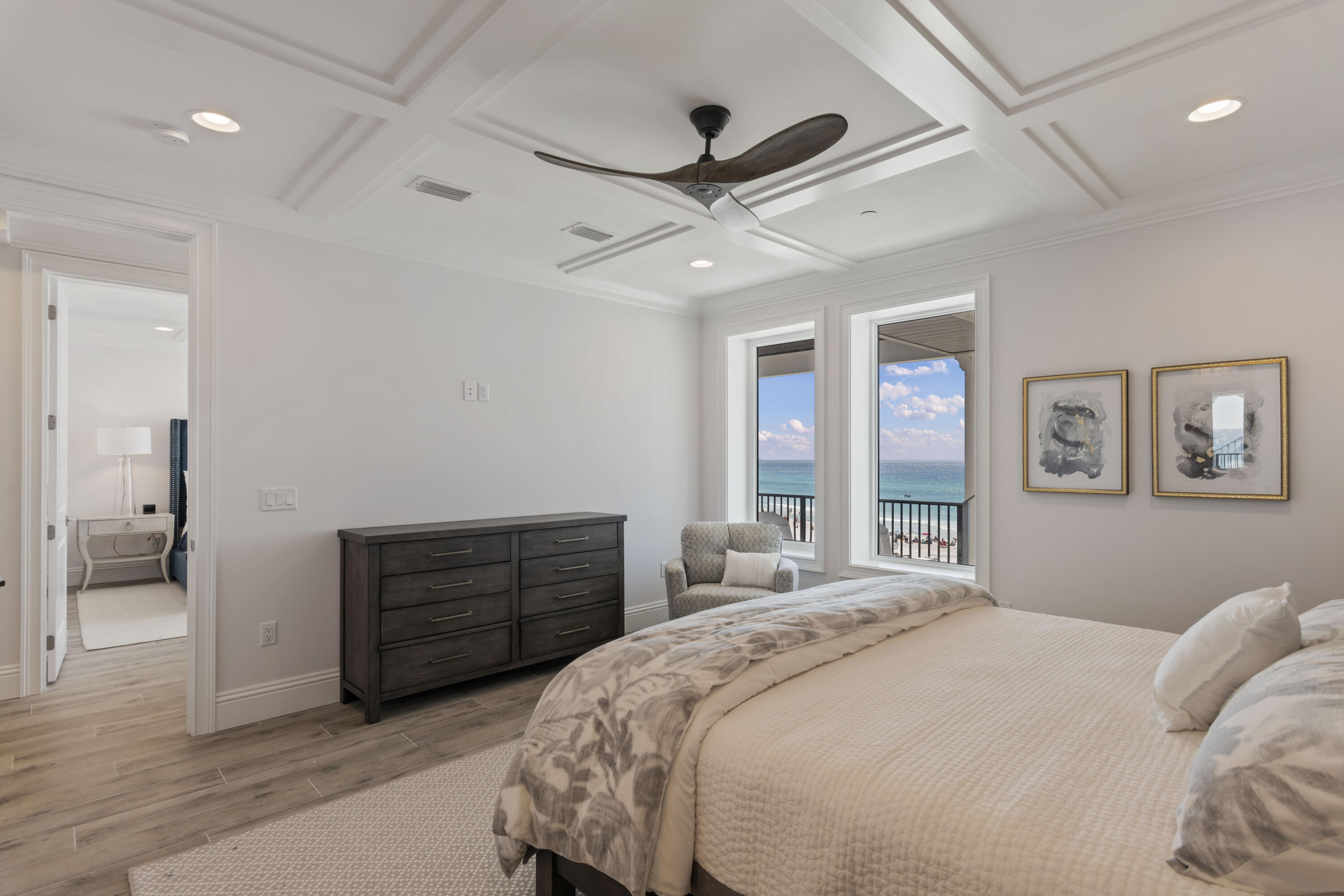 26 Azzurro Way, Unit B Santa Rosa Beach, FL 32459 - Photo 24 of 34 a bedroom with a bed and a chandelier