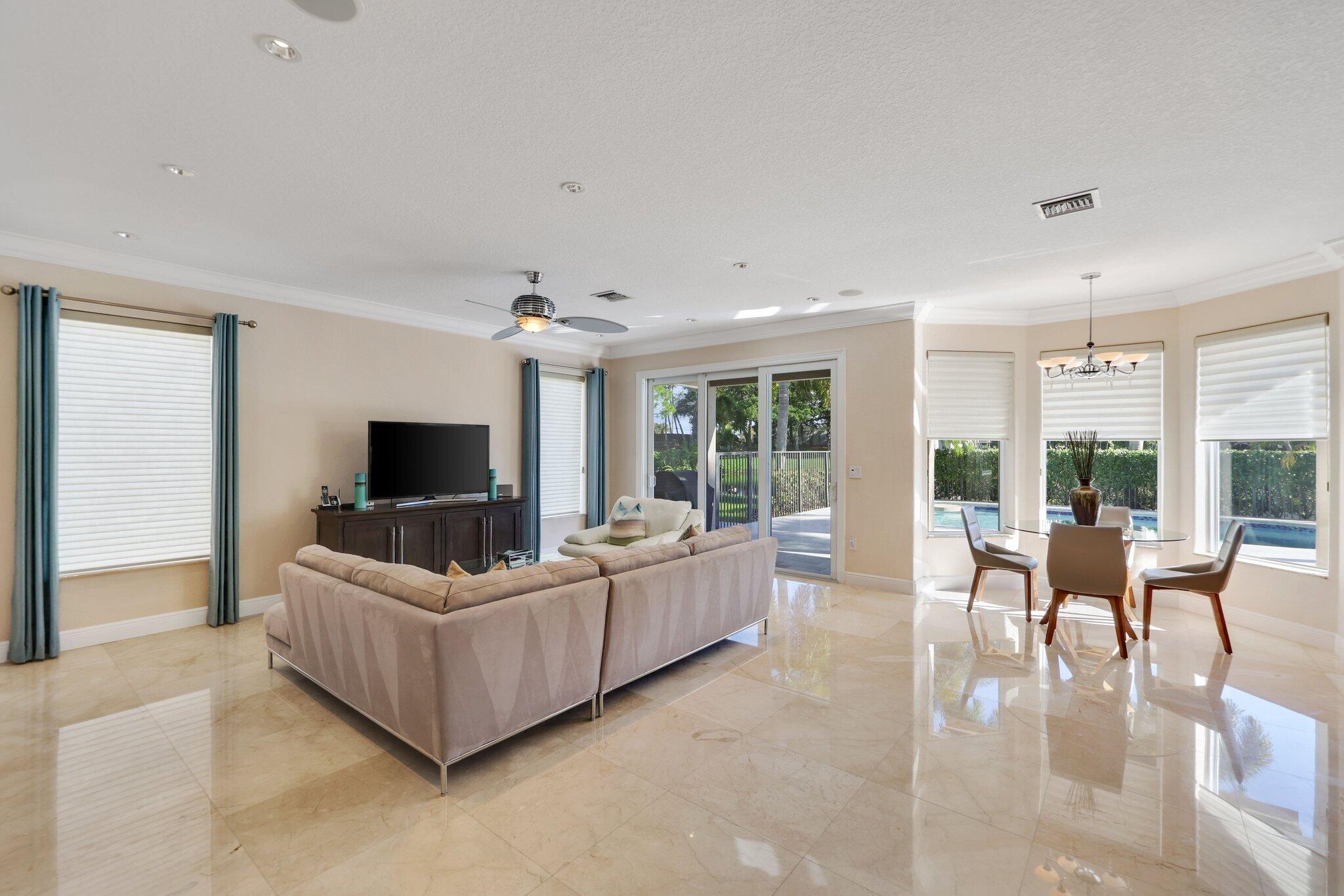 19245 Skyridge Circle Boca Raton, FL 33498 - Photo 20 of 70 a living room with furniture and a flat screen tv