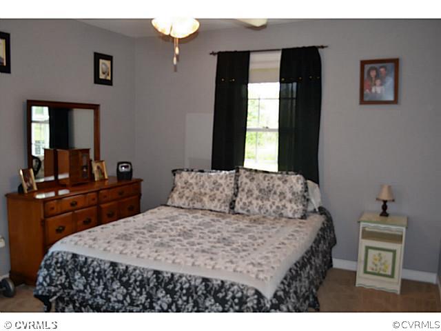 1541 Johns Road Carson, VA 23830 - Photo 11 of 24 a bedroom with a bed and a desk