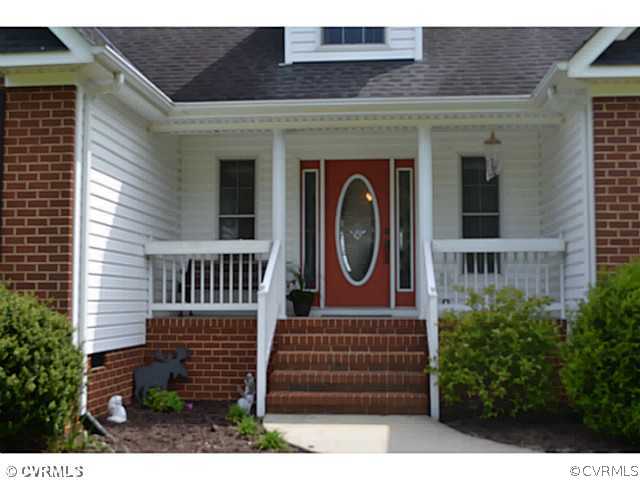 1541 Johns Road Carson, VA 23830 - Photo 17 of 24 a front view of a house with a yard