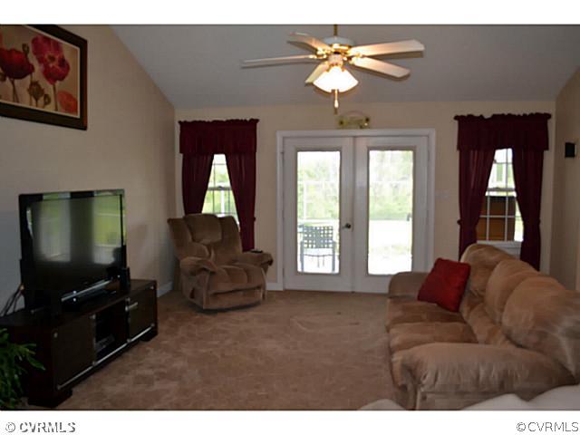1541 Johns Road Carson, VA 23830 - Photo 3 of 24 a living room with furniture and a flat screen tv
