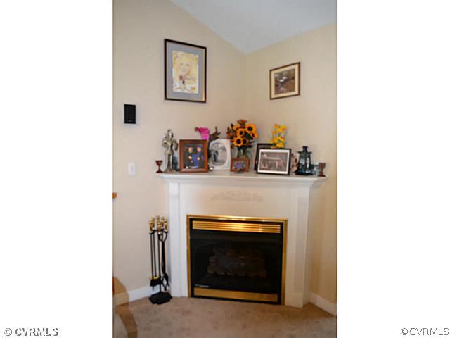 1541 Johns Road Carson, VA 23830 - Photo 5 of 24 a living room with furniture and a fireplace