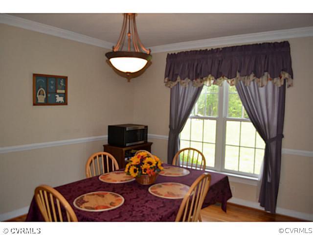 1541 Johns Road Carson, VA 23830 - Photo 10 of 24 a view of a dining room with furniture and a window