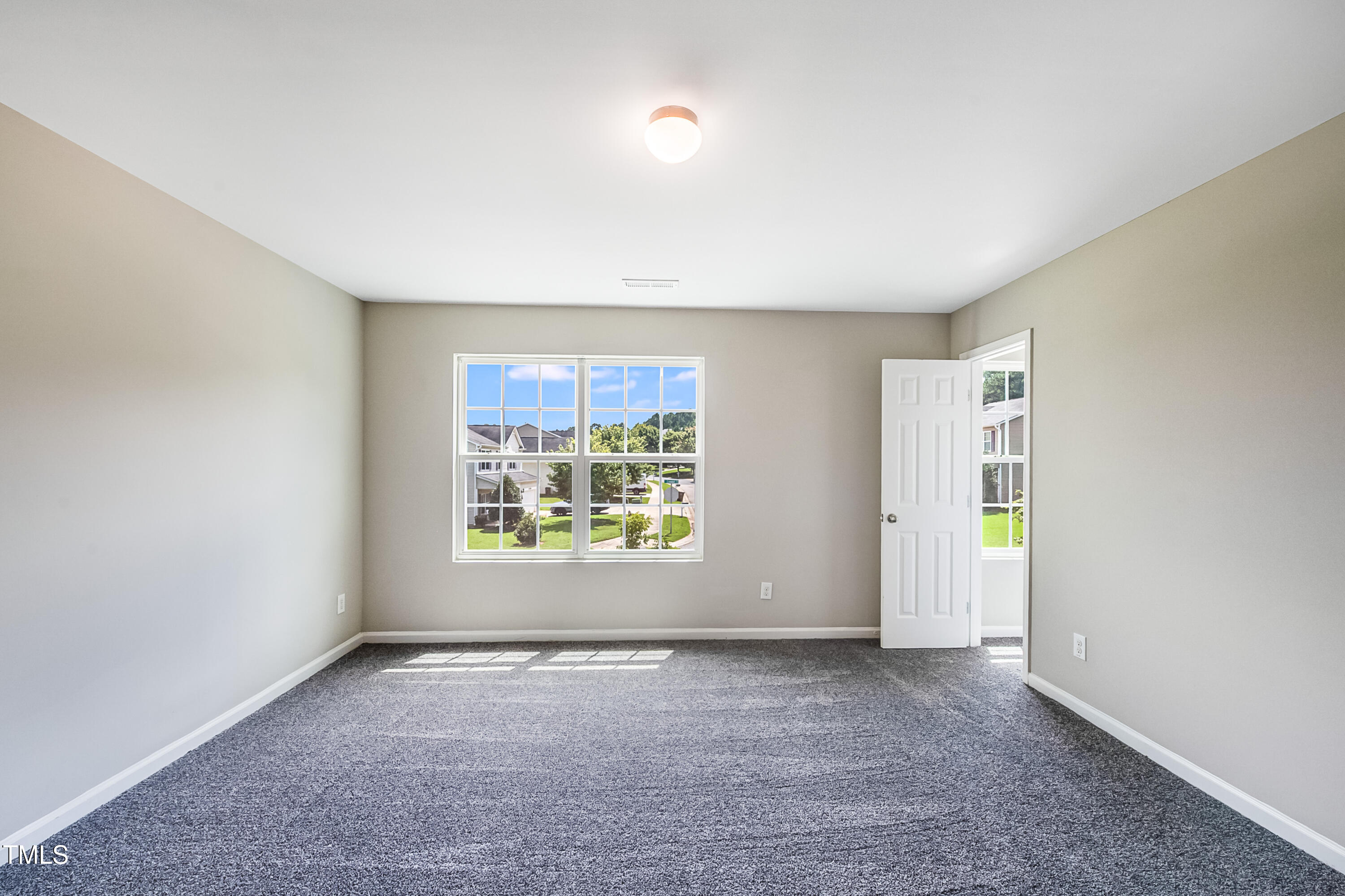1116 Crendall Way Wake Forest, NC 27587 - Photo 12 of 33 an empty room with windows