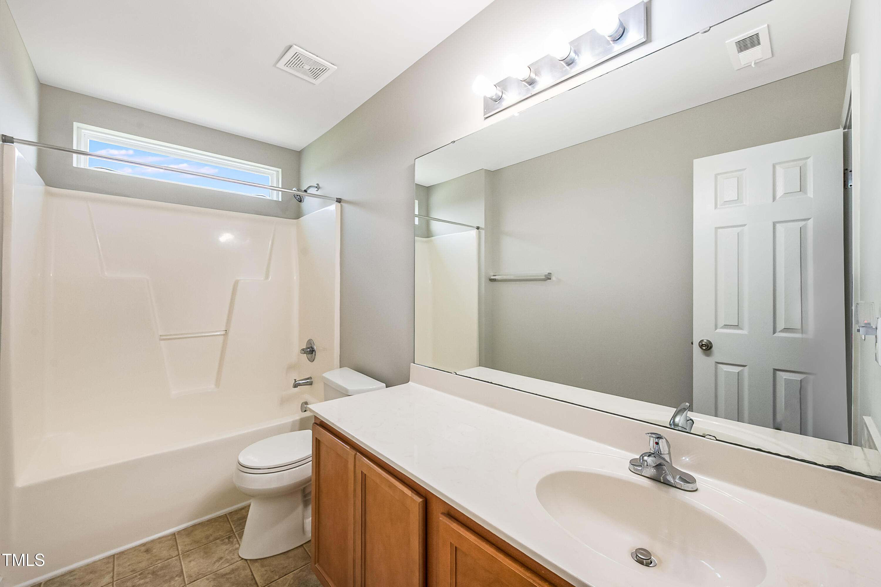 1116 Crendall Way Wake Forest, NC 27587 - Photo 13 of 33 a bathroom with a sink a toilet and shower