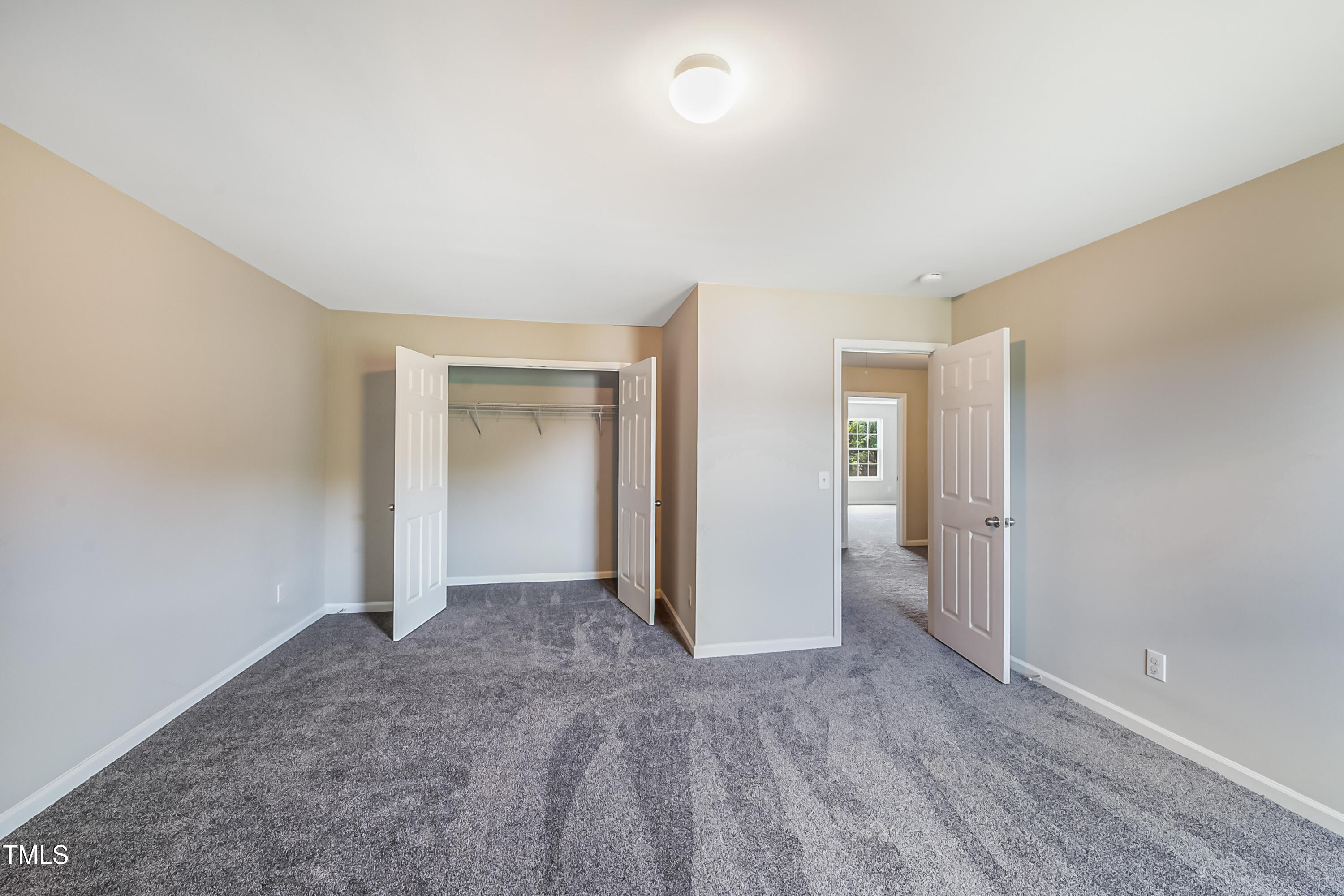 1116 Crendall Way Wake Forest, NC 27587 - Photo 14 of 33 an empty room with closet and a bathroom