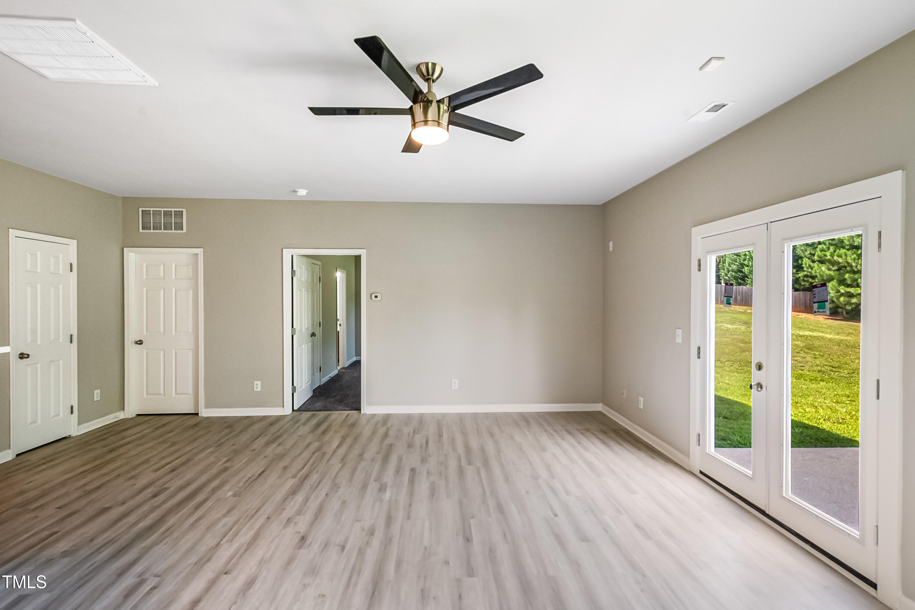 1116 Crendall Way Wake Forest, NC 27587 - Photo 29 of 33 wooden floor in an empty room with a window