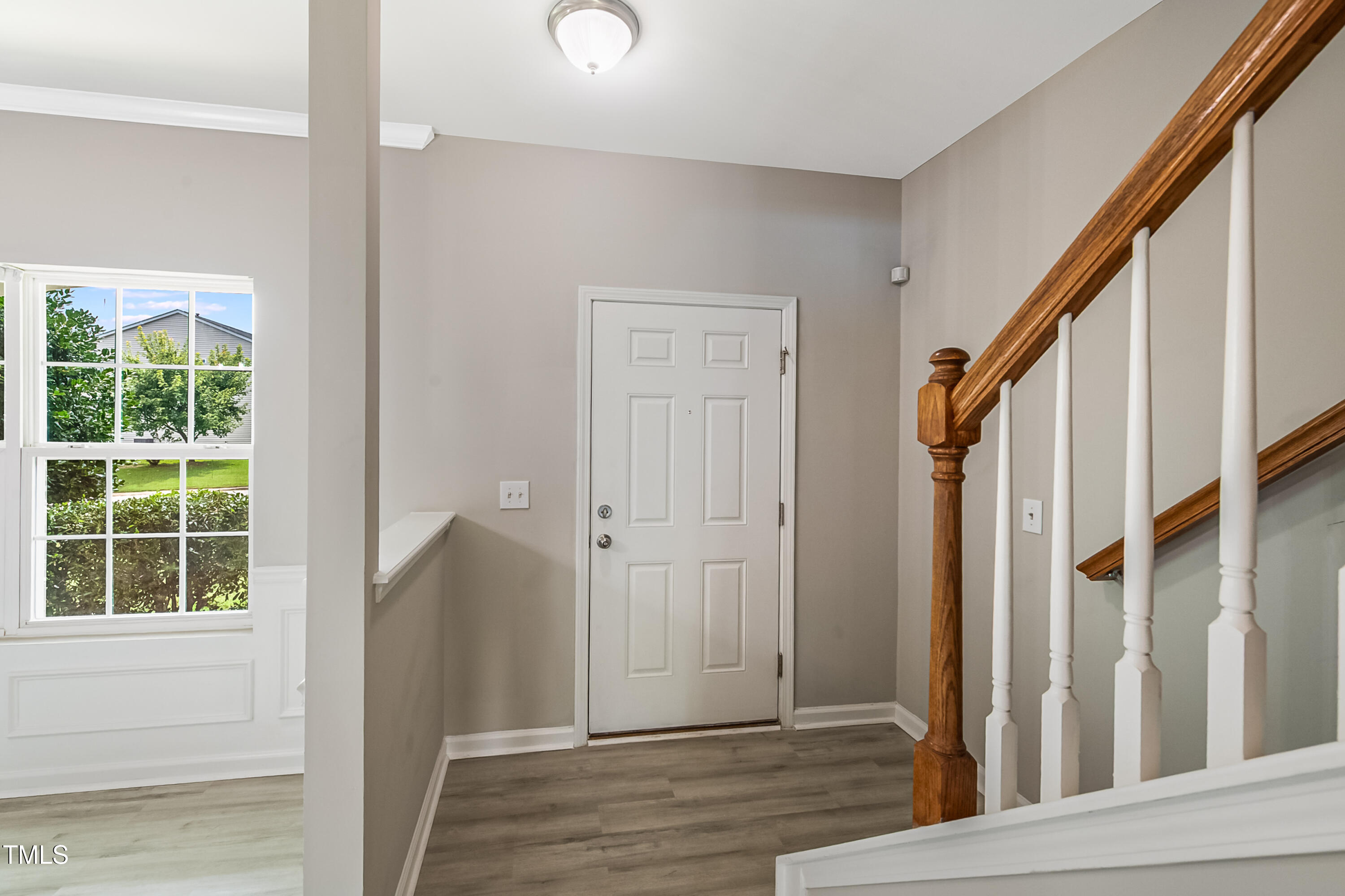 1116 Crendall Way Wake Forest, NC 27587 - Photo 6 of 33 a view of an entryway with wooden floor and door