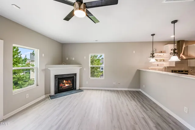 a view of a room window and wooden floor