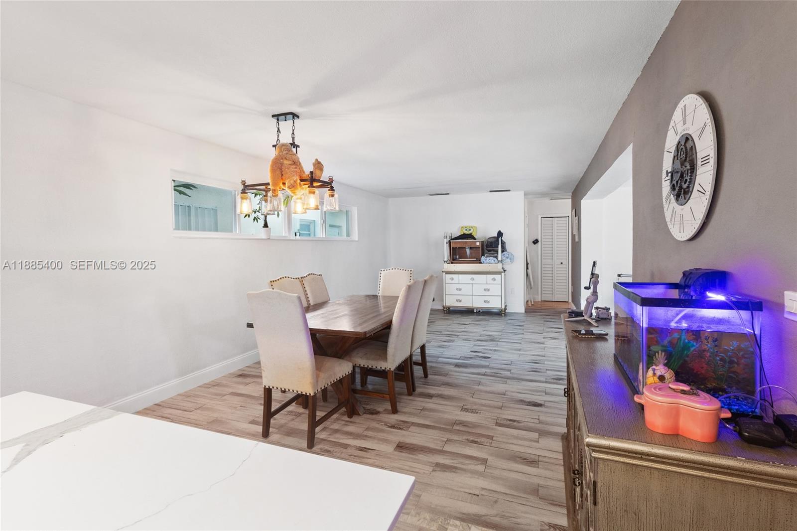 3510 Southwest 87th Avenue Miami, FL 33165 - Photo 5 of 10 a workspace with furniture and wooden floor