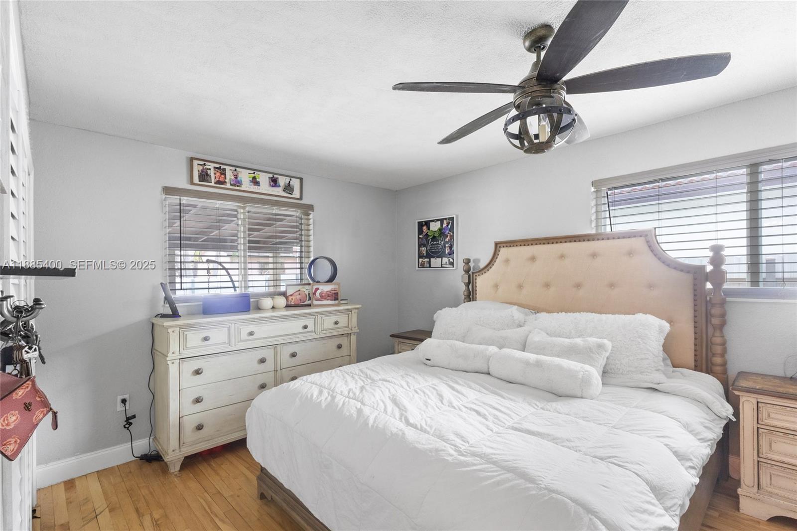 3510 Southwest 87th Avenue Miami, FL 33165 - Photo 6 of 10 a bedroom with a large bed and a window