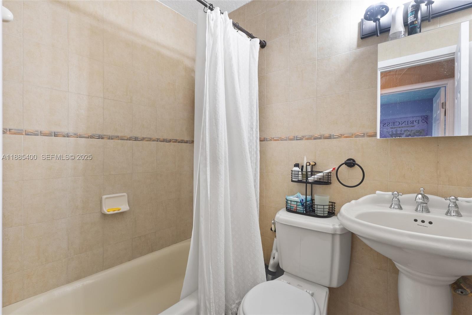 3510 Southwest 87th Avenue Miami, FL 33165 - Photo 8 of 10 a bathroom with a sink toilet and shower