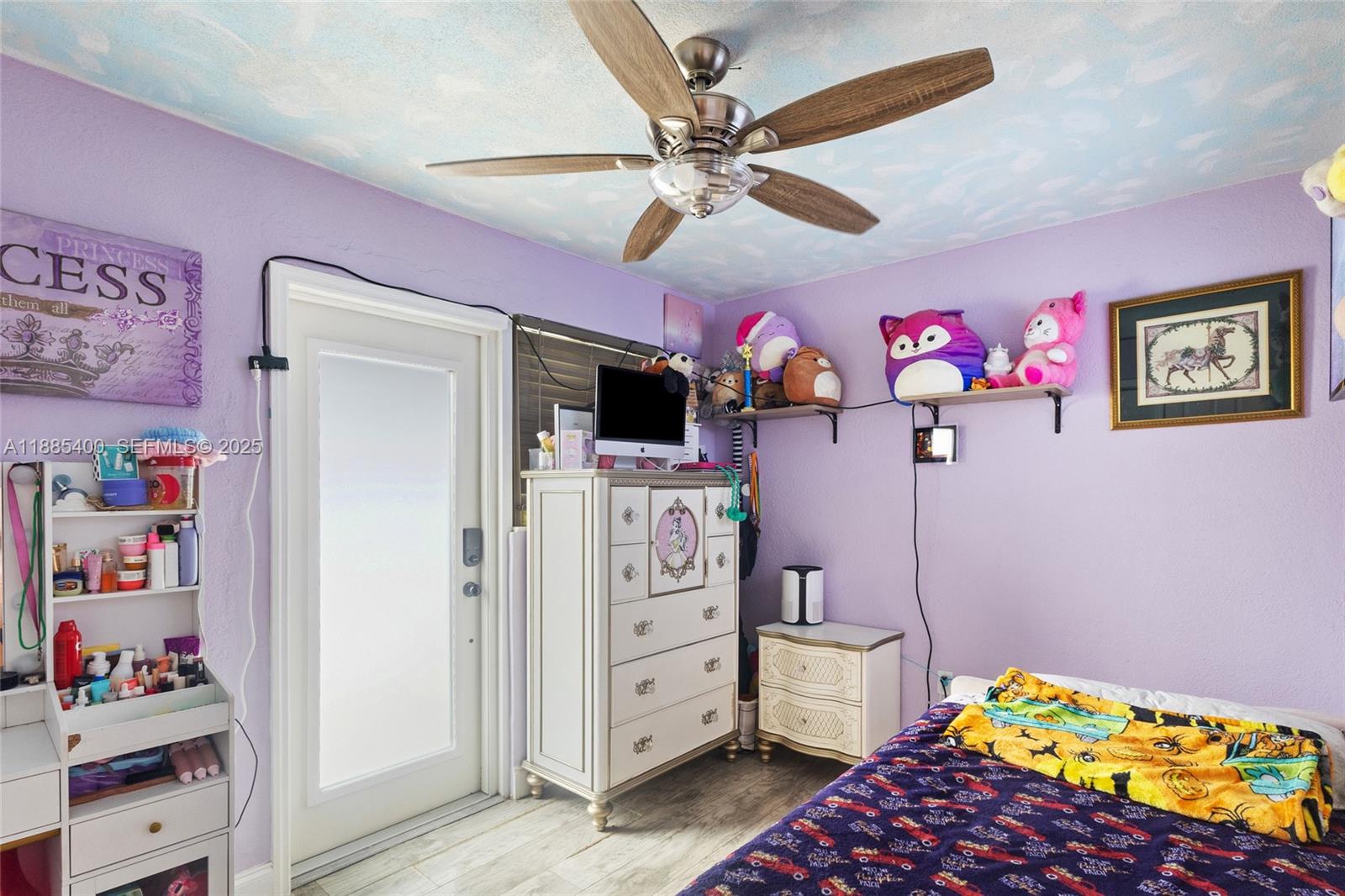 3510 Southwest 87th Avenue Miami, FL 33165 - Photo 9 of 10 a bedroom with furniture and a flat screen tv