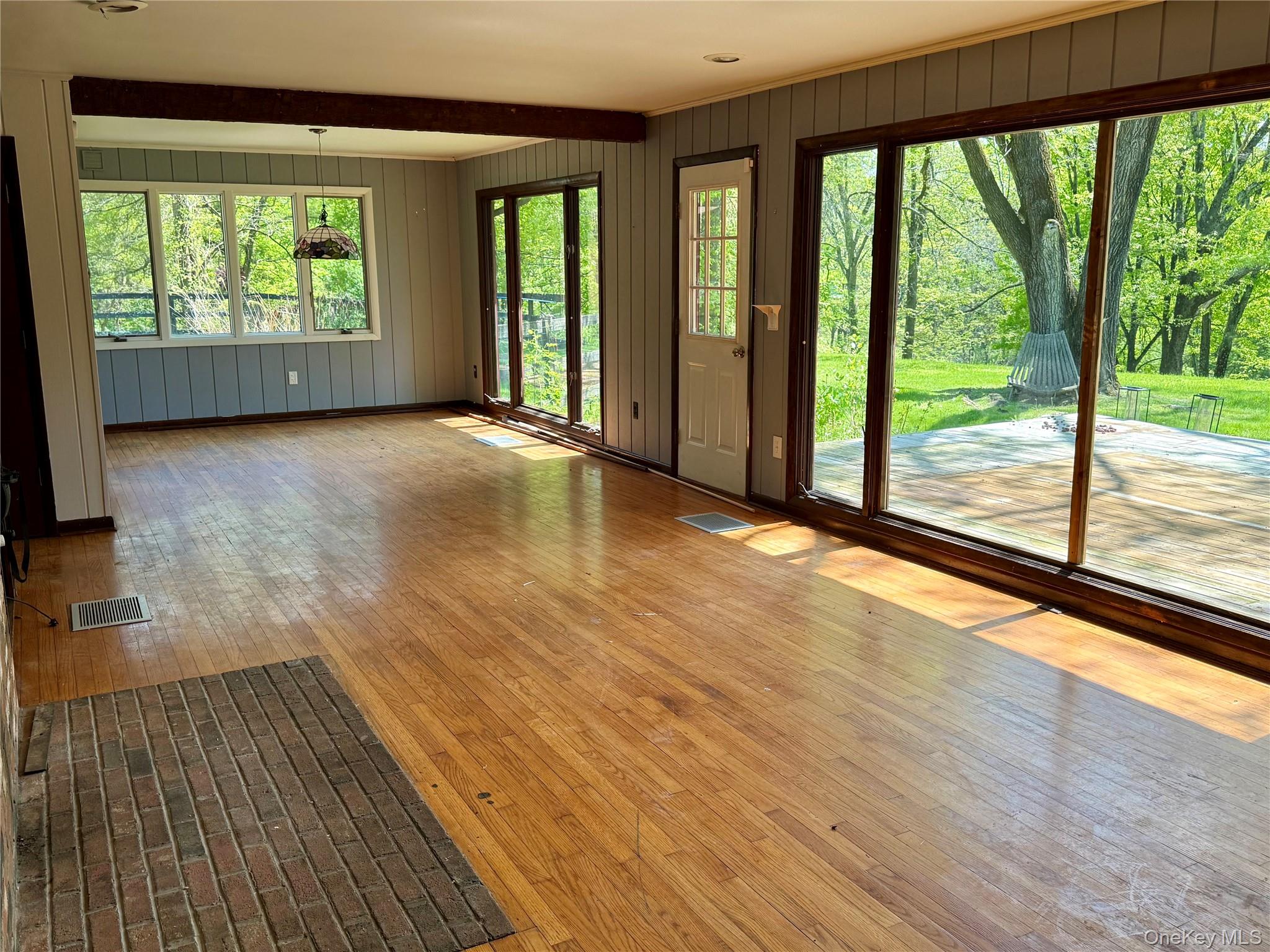 183 Barrytown Road Barrytown, NY 12507 - Photo 12 of 41 a view of an empty room with wooden floor and a window