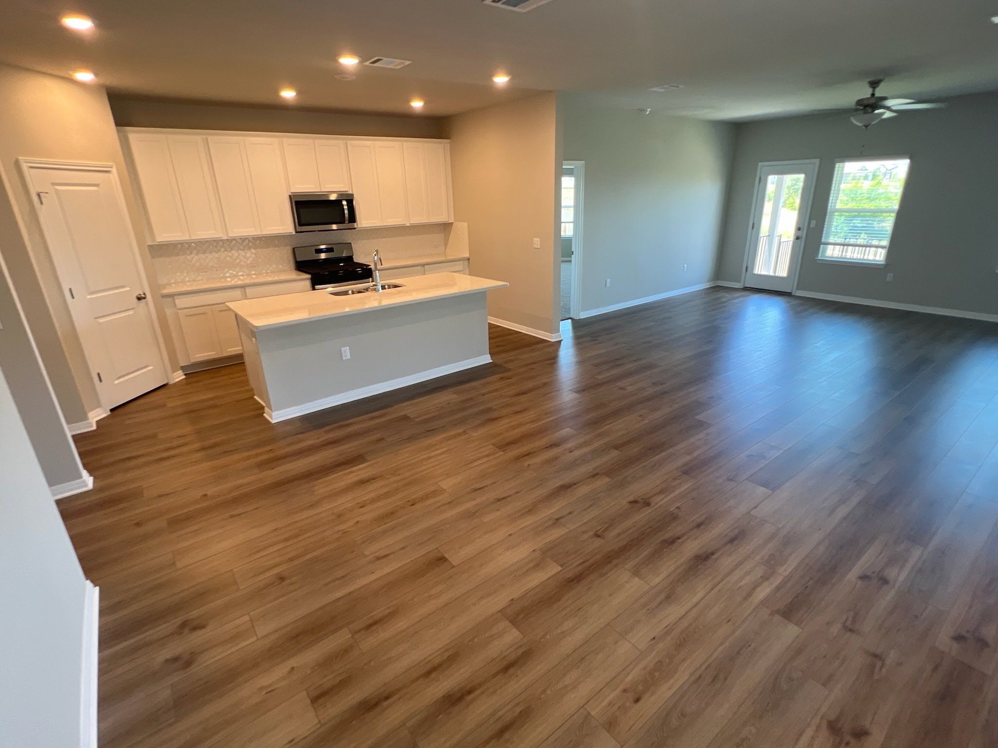 6400 Rounded Pebble Lane Buda, TX 78610 - Photo 21 of 34 a view of kitchen with sink and refrigerator