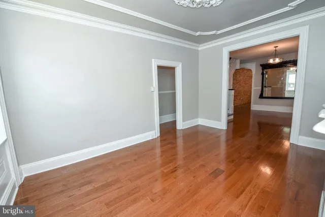 a view of hallway with wooden floor