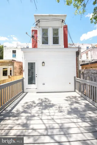 a bathroom with a sink mirror and vanity