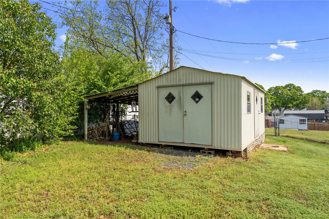 1007 Brown Road Anderson, SC 29621 - Photo 26 of 27 This expansive yard features a versatile storage shed, offering ample space for all your outdoor needs.