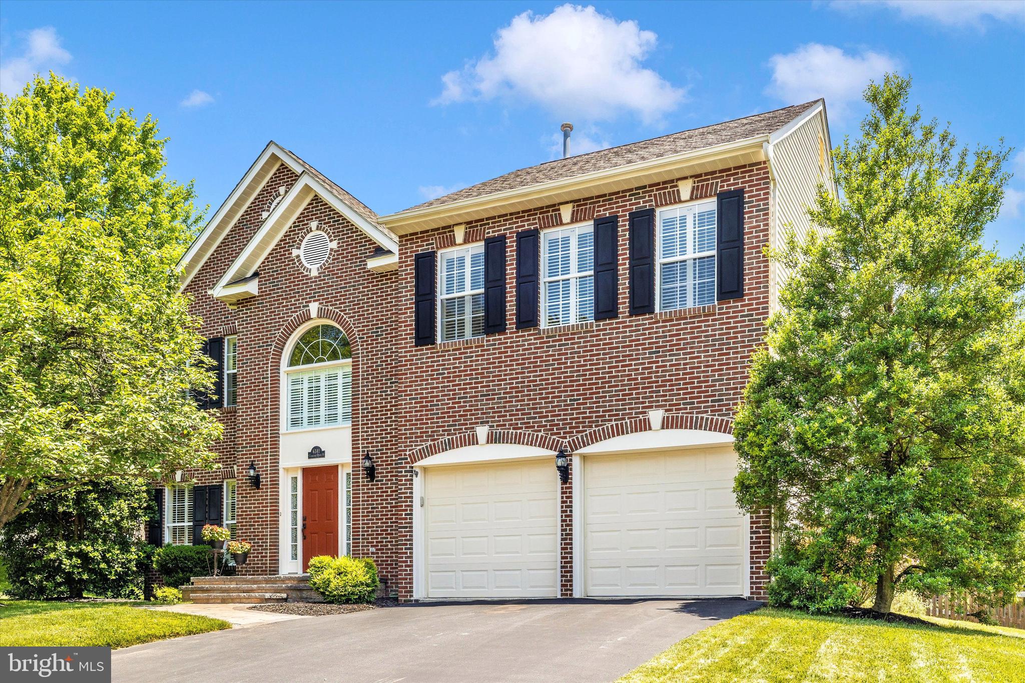 6341 Claridge Drive North Frederick, MD 21701 - Photo 1 of 54 a front view of a house with a yard and garage