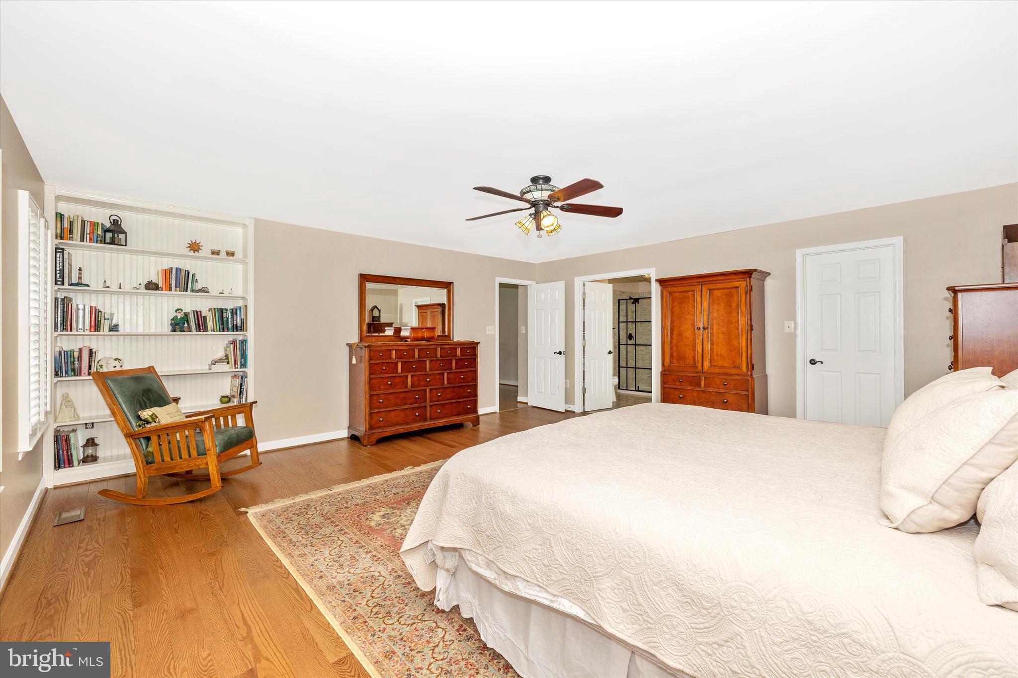 6341 Claridge Drive North Frederick, MD 21701 - Photo 16 of 54 a spacious bedroom with a bed a couch and dresser in it