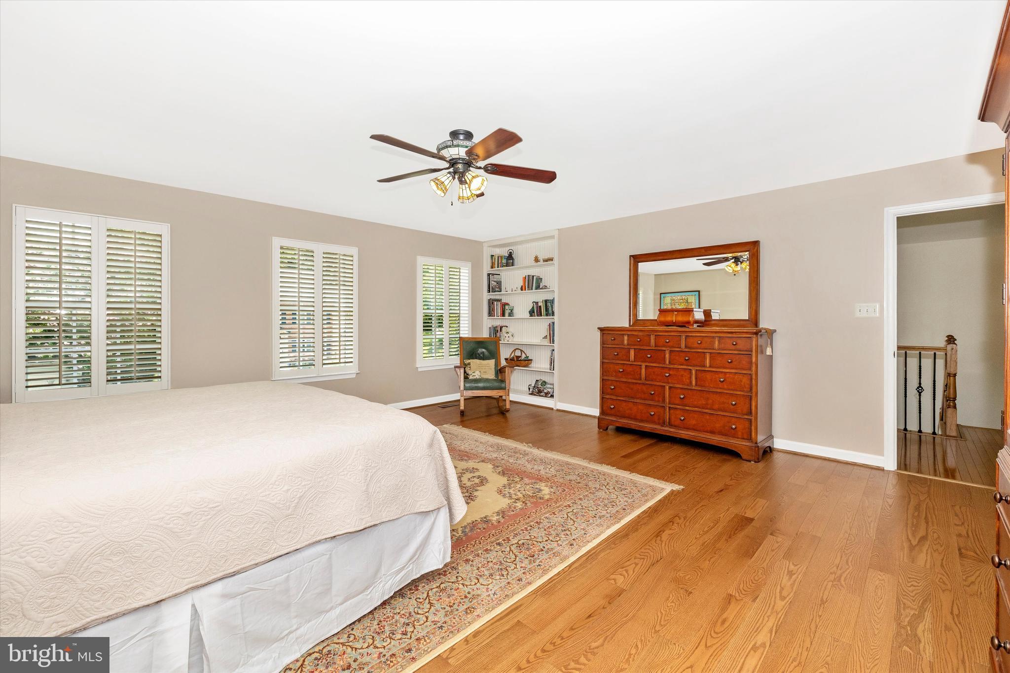 6341 Claridge Drive North Frederick, MD 21701 - Photo 17 of 54 a spacious bedroom with a bed and wooden floor