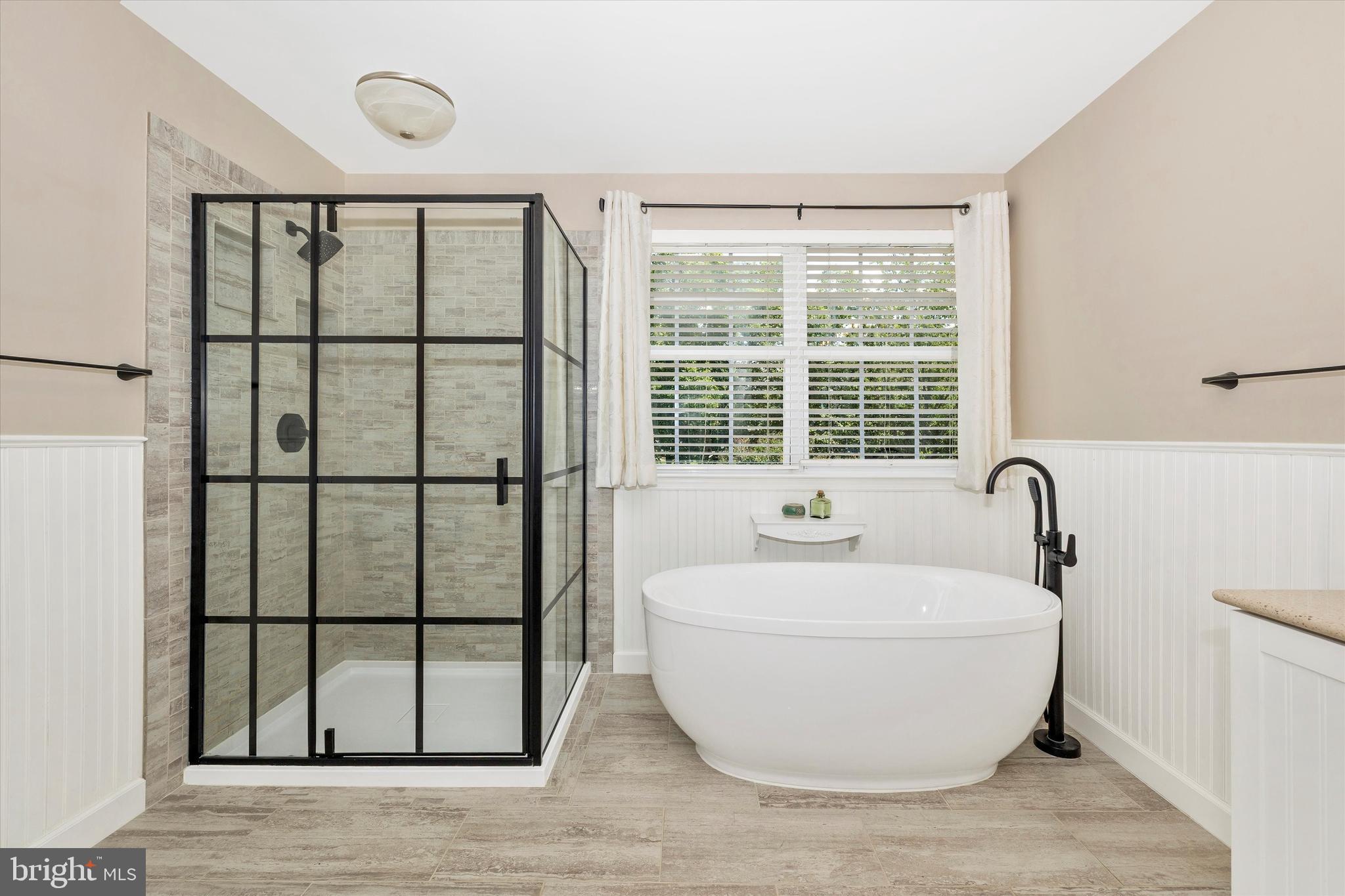 6341 Claridge Drive North Frederick, MD 21701 - Photo 21 of 54 a white bath tub sitting next to a window
