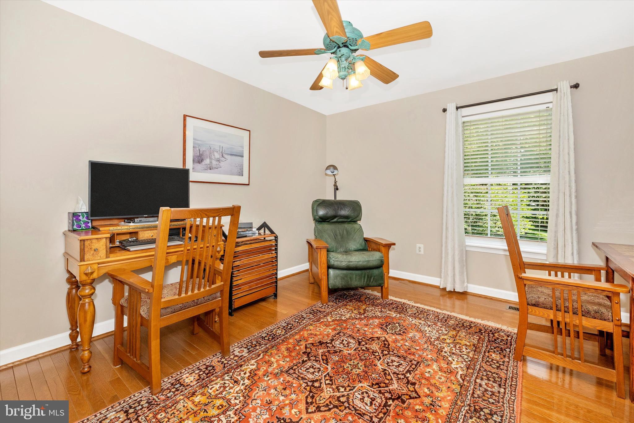6341 Claridge Drive North Frederick, MD 21701 - Photo 23 of 54 a living room with furniture a flat screen tv and a window