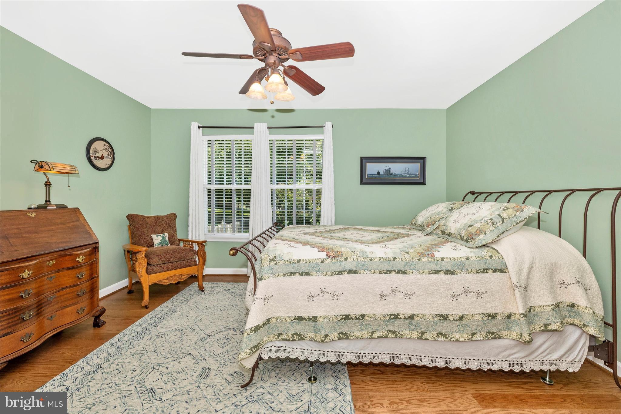 6341 Claridge Drive North Frederick, MD 21701 - Photo 25 of 54 a bedroom with a bed and a chandelier