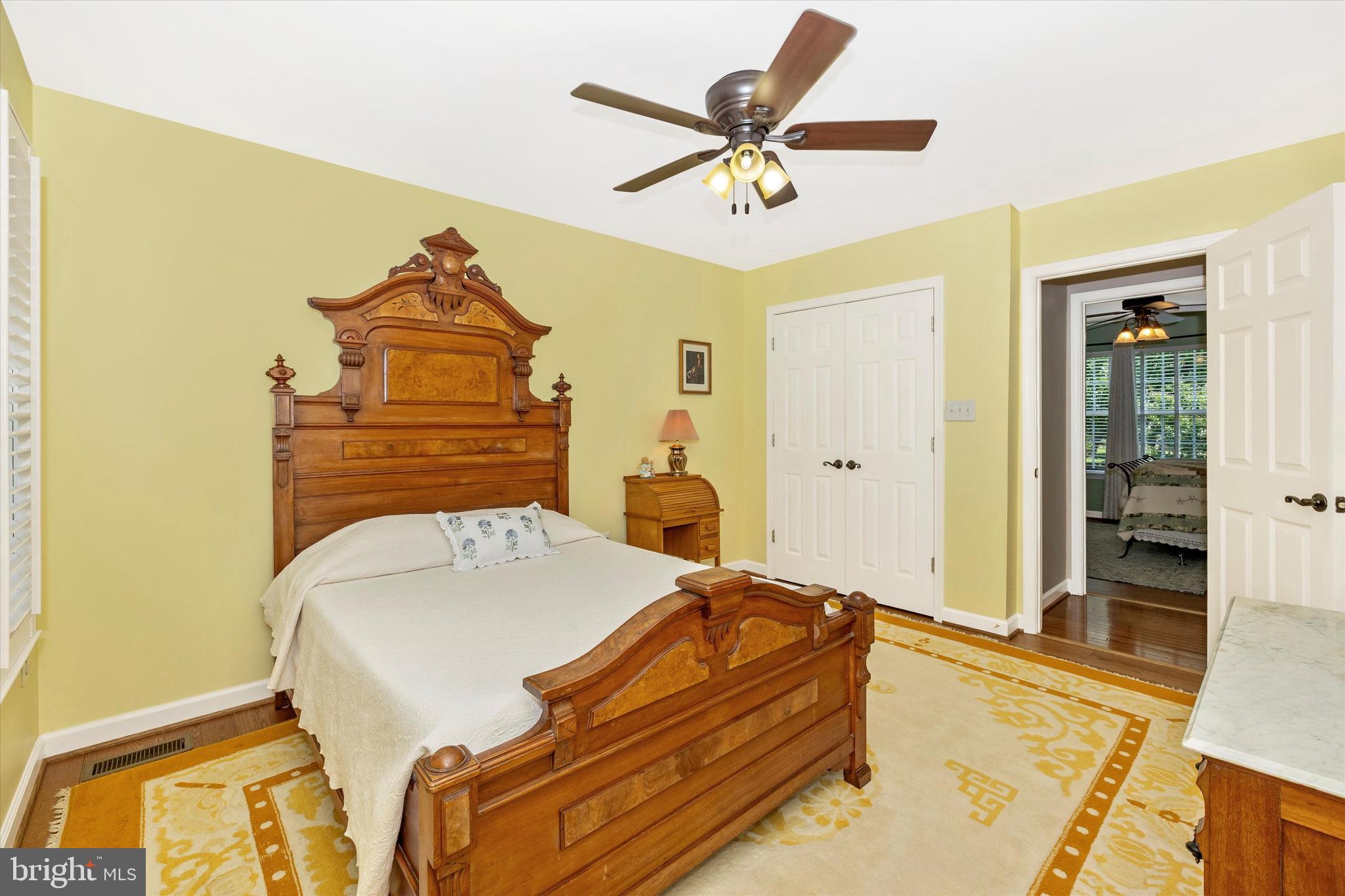 6341 Claridge Drive North Frederick, MD 21701 - Photo 26 of 54 a bedroom with a bed and a chandelier