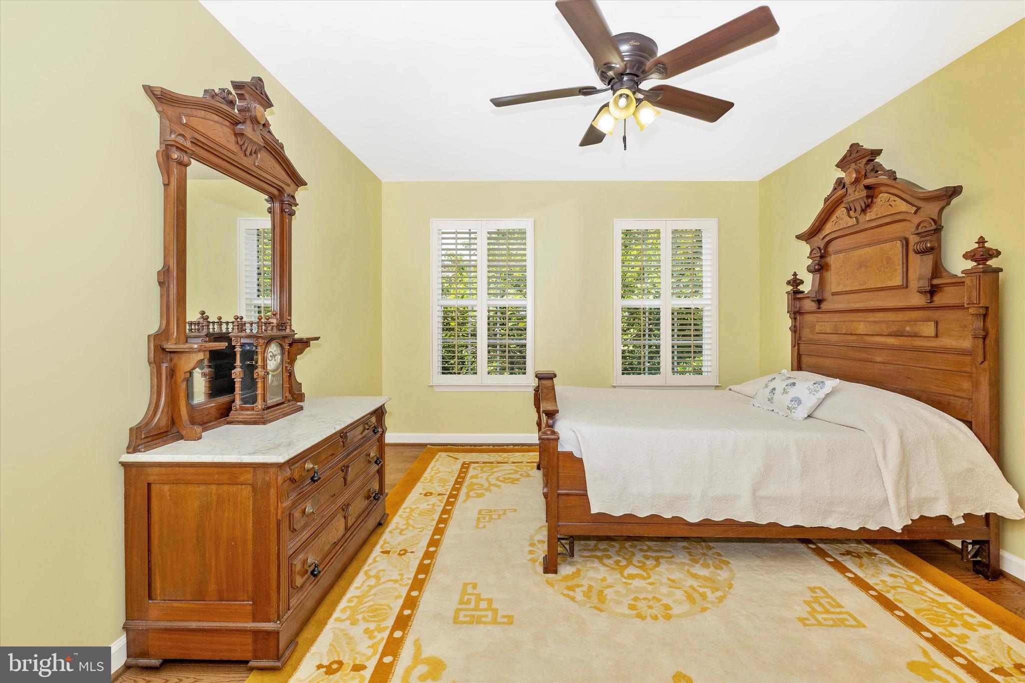 6341 Claridge Drive North Frederick, MD 21701 - Photo 27 of 54 a spacious bedroom with a bed and a chandelier