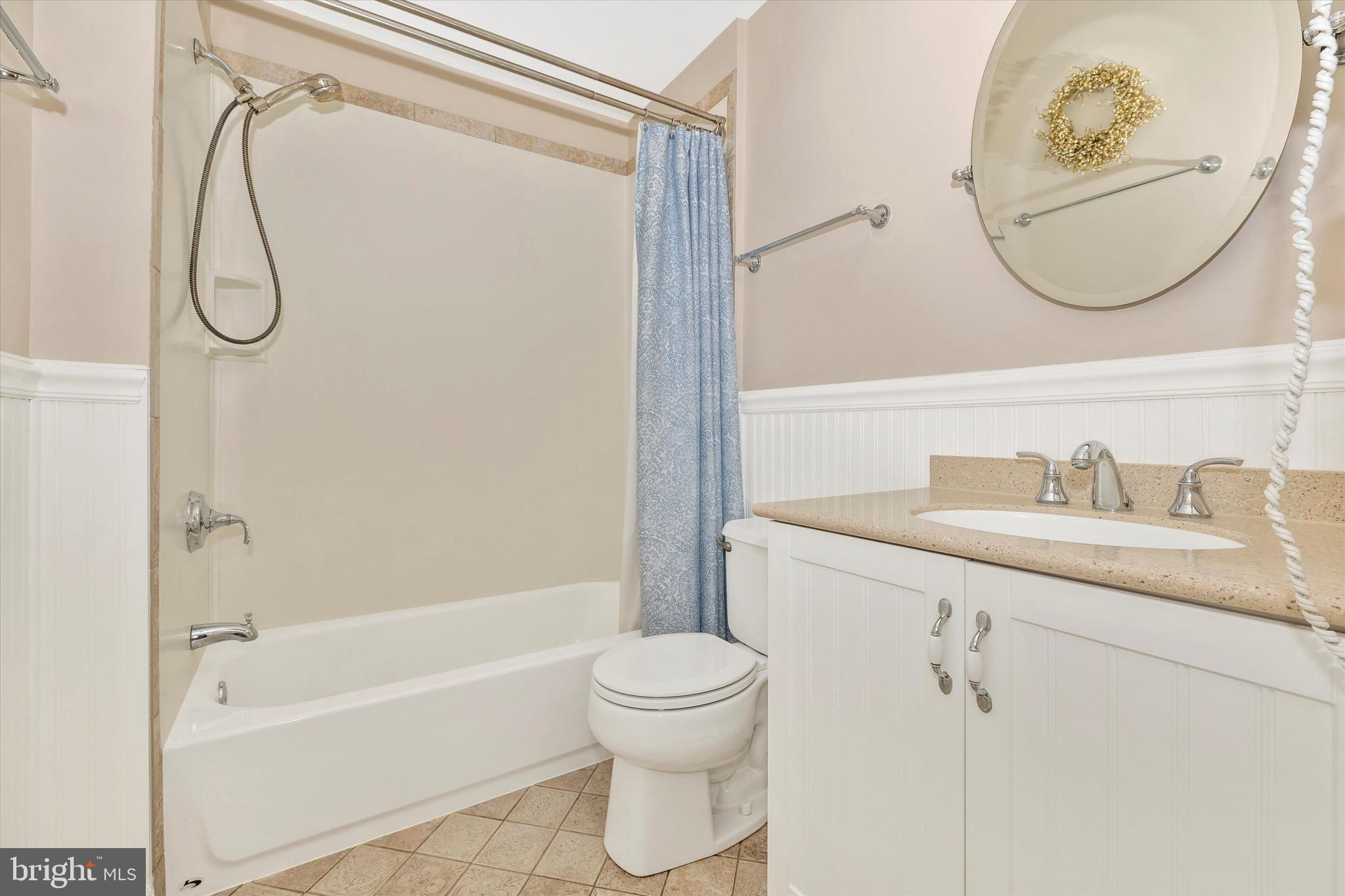 6341 Claridge Drive North Frederick, MD 21701 - Photo 28 of 54 a bathroom with a granite countertop sink a toilet and a mirror